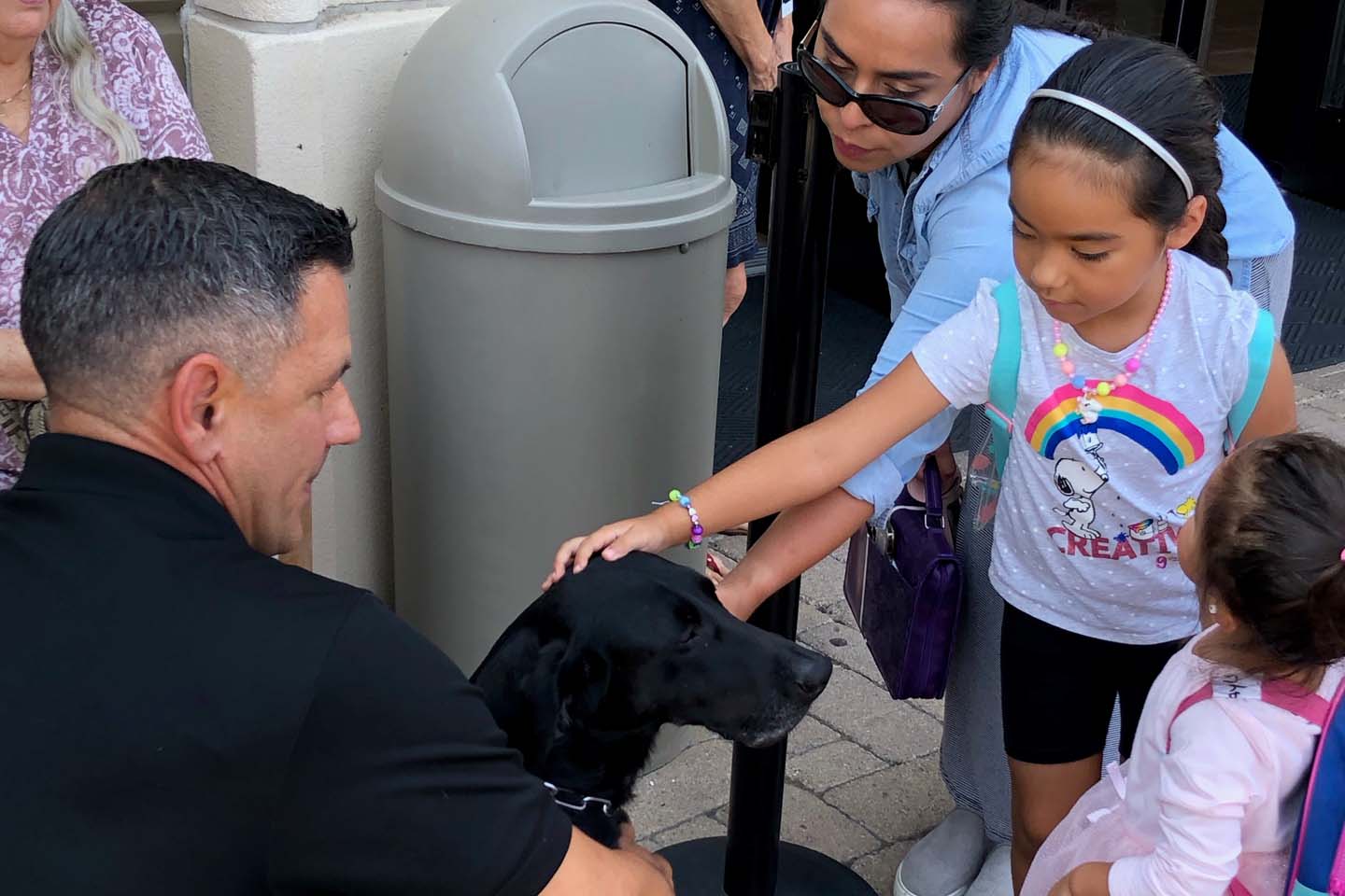 Jon and Sammy greeting event attendees