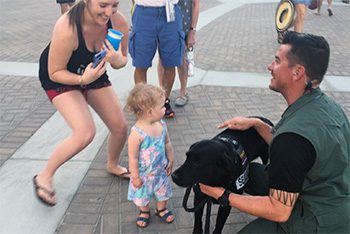 Bomb dog Jon and Sammy greeting event attendees